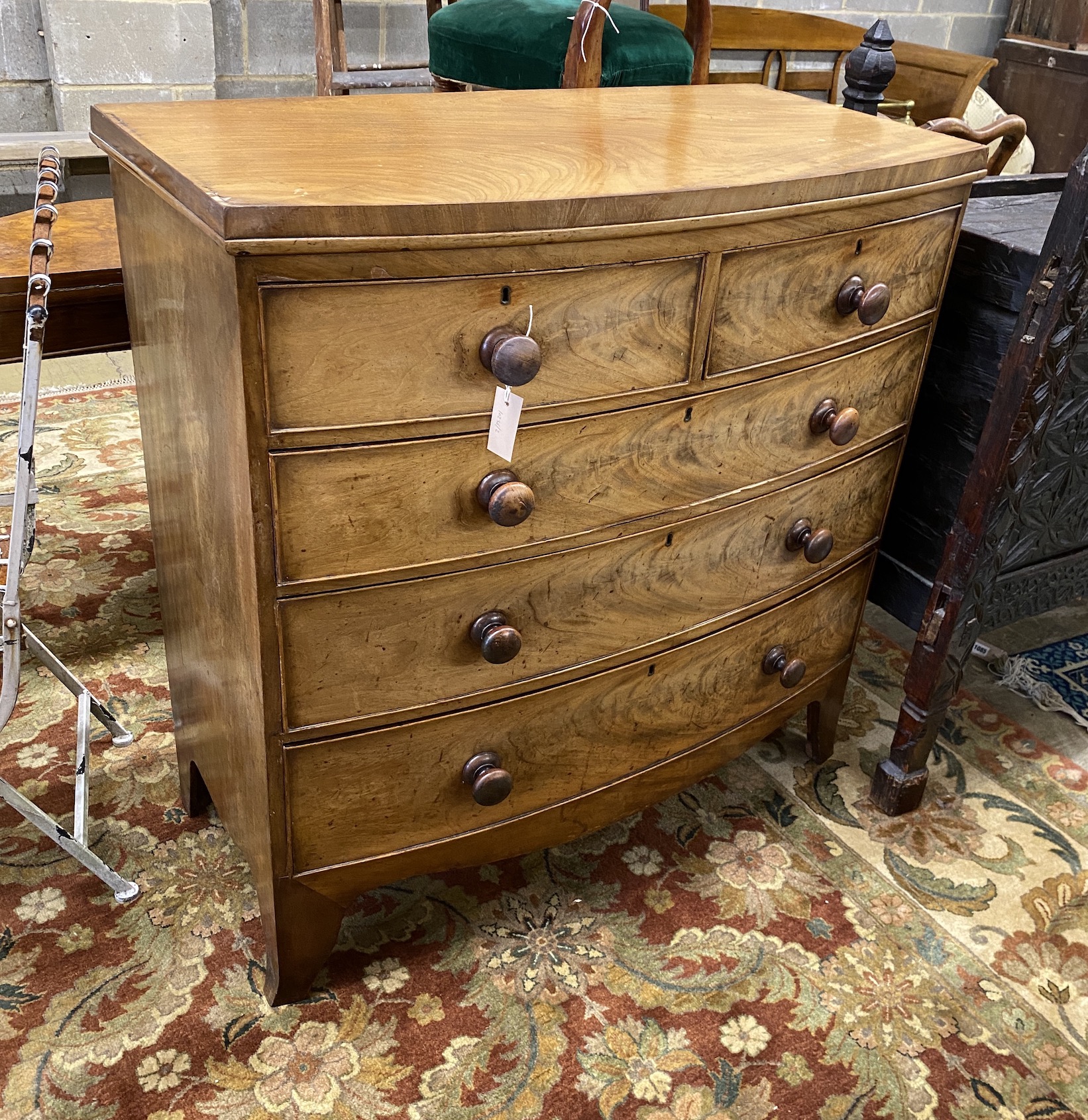 A Regency faded mahogany bow front chest of drawers, width 100cm, depth 50cm, height 102cm